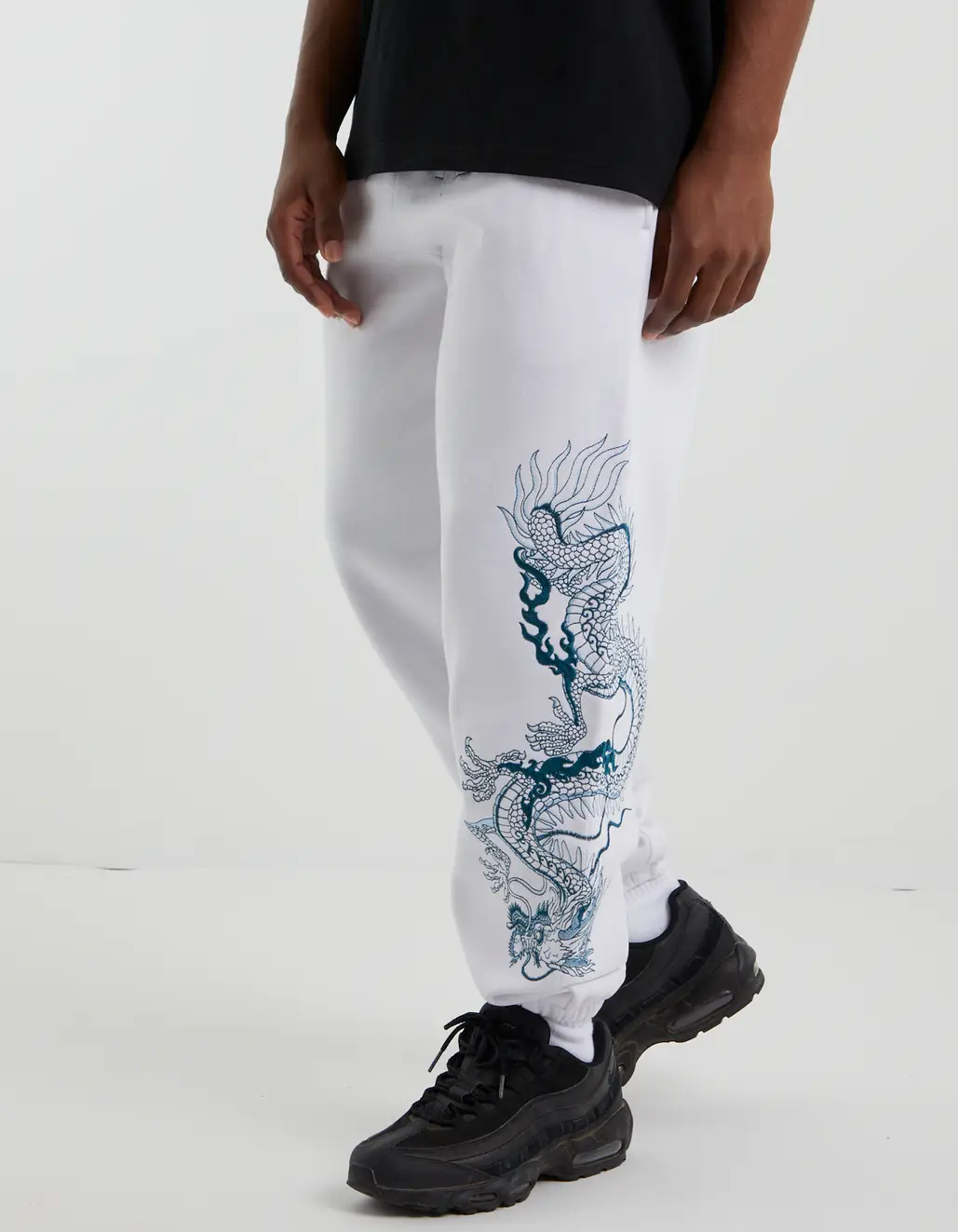 DRAGON EMBROIDERED BAGGY TRACK PANTS IN WHITE